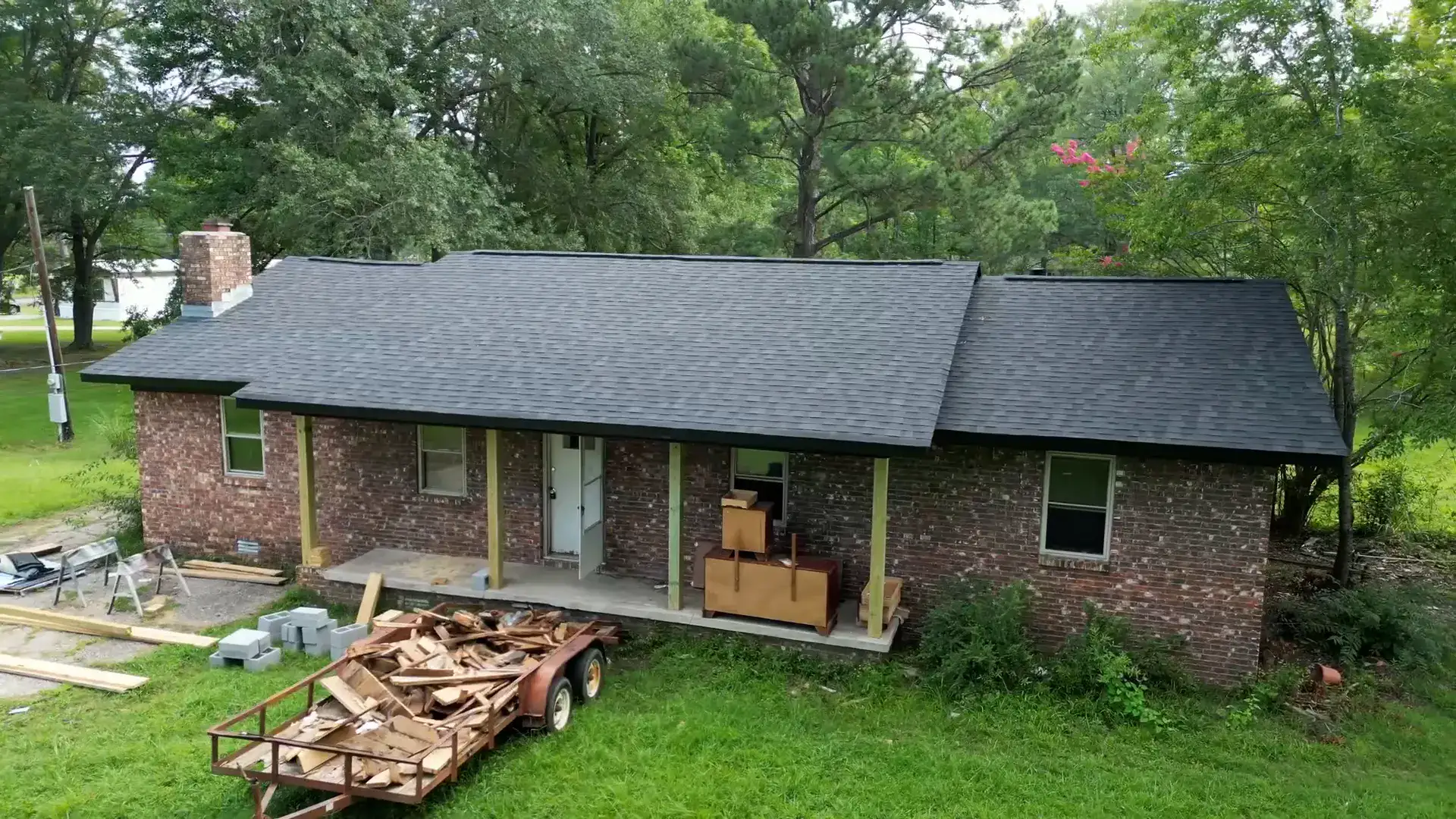 Established neighborhood brick ranch home with a freshly finished shingle roof